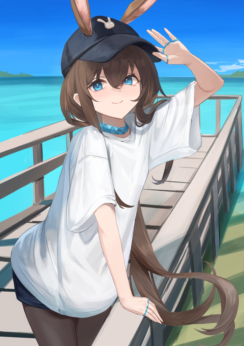 1girl absurdres adjusting_clothes adjusting_headwear amiya_(arknights) animal_ears arknights arm_up black_hat blue_collar blue_eyes brown_hair brown_pantyhose casual closed_mouth collar commentary cowboy_shot day ears_through_headwear hair_between_eyes hat highres horizon jewelry long_hair looking_at_viewer multiple_rings ocean outdoors pantyhose peaked_cap railing remapack77 ring shirt short_sleeves smile solo standing t-shirt very_long_hair water white_shirt