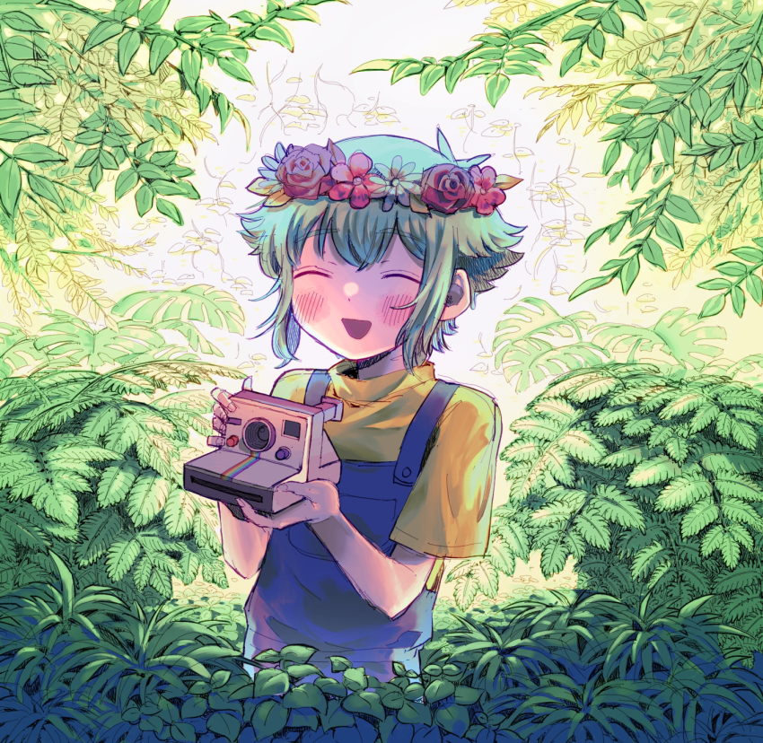1boy antenna_hair basil_(headspace)_(omori) basil_(omori) blue_overalls blush camera closed_eyes day flower green_hair head_wreath highres holding holding_camera male_focus miranosub omori open_mouth outdoors overalls shirt short_hair short_sleeves smile solo t-shirt yellow_shirt