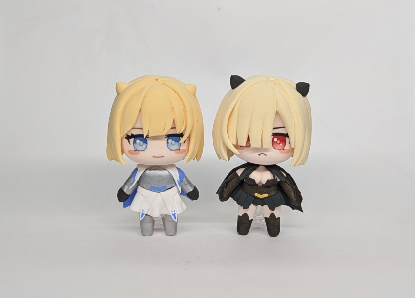 1girl armor black_cape black_dress black_gloves blonde_hair blue_eyes blush blush_stickers breastplate breasts brown_dust_(series) brown_dust_2 cape chibi clay_(medium) cleavage closed_mouth demon_horns dress dual_persona eyebrows_hidden_by_hair fang figure full_body gloves greaves grey_background hair_over_one_eye heuk_s highres horns justia_(blood_glutton)_(brown_dust) justia_(brown_dust) looking_at_viewer medium_breasts red_eyes shadow simple_background skirt small_horns smile unconventional_media vambraces white_skirt