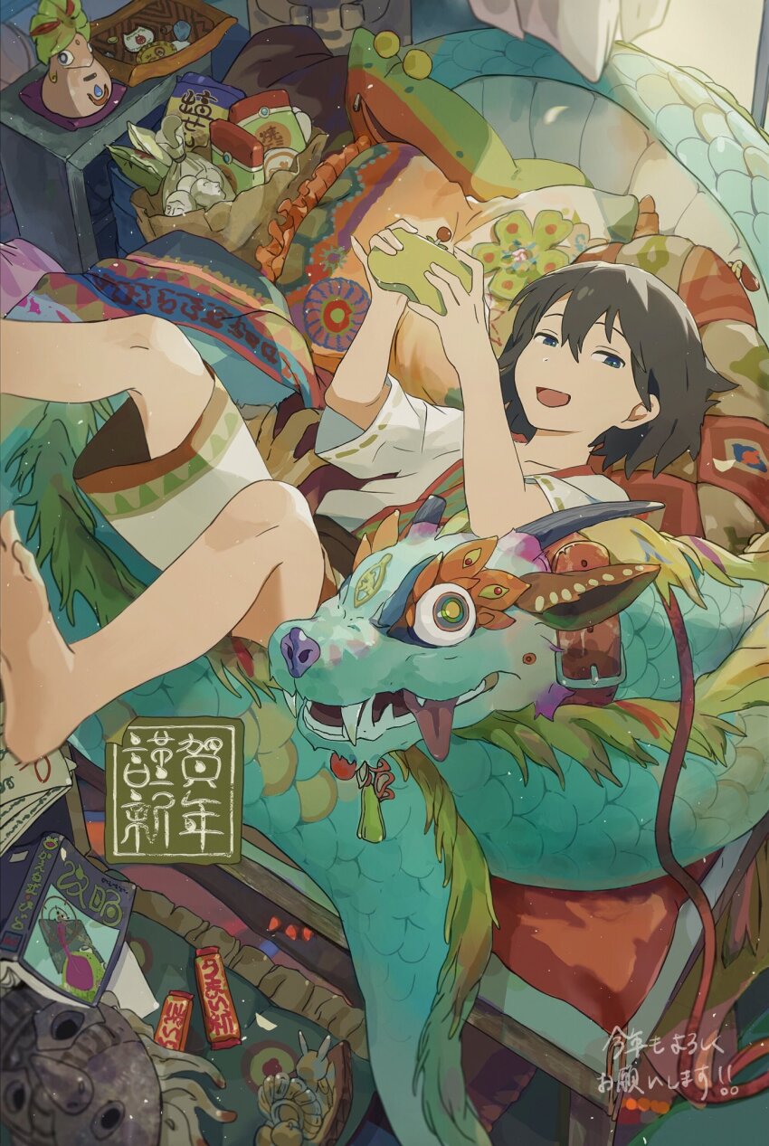 1girl barefoot black_hair blue_eyes book chakotata chinese_zodiac commentary_request dragon eastern_dragon happy_new_year highres indoors lying new_year on_back open_mouth original smile solo stuffed_animal stuffed_dragon stuffed_toy year_of_the_dragon