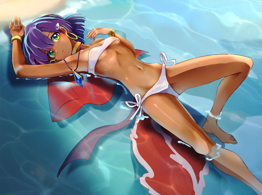 1girl arm_up armpits bandeau bare_shoulders barefoot beach blush bob_cut bracelet breasts brown_sash closed_mouth unworn_clothes commentary dark-skinned_female dark_skin earrings expressionless fushigi_no_umi_no_nadia gem green_eyes hair_ornament hairclip highres hip_bones hoop_earrings jewelry knee_up looking_at_viewer lying nadia_la_arwall navel neck_ribbon necklace ocean okken panties partially_immersed pelvic_curtain purple_hair red_vest ribbon sash short_hair side-tie_panties small_breasts solo underboob underwear vest unworn_vest white_bandeau