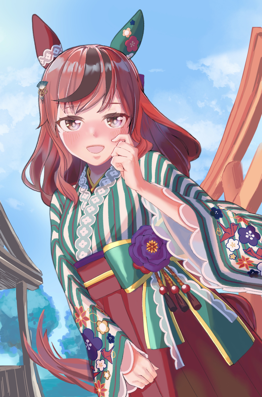 1girl absurdres animal_ears blurry blurry_background blush brown_eyes collarbone commentary_request ear_covers fidgeting hair_ornament highres horse_ears horse_girl japanese_clothes kaninoto kimono long_hair looking_at_viewer medium_hair nice_nature_(converging_wishes)_(umamusume) nice_nature_(umamusume) official_alternate_costume official_alternate_hairstyle open_mouth outdoors red_hair shrine solo sparkle umamusume