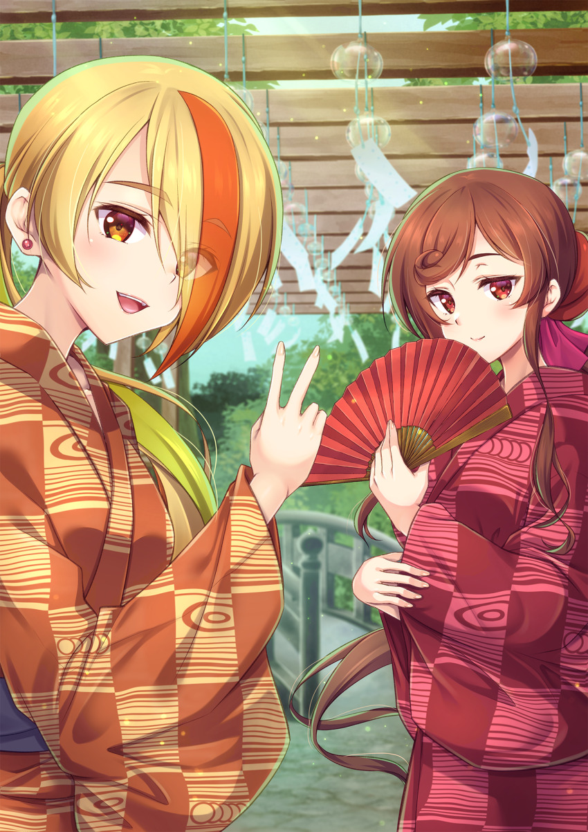 2girls :d blonde_hair blurry blurry_background brown_eyes brown_hair day eyes_visible_through_hair floating_hair hair_over_one_eye hand_fan highres holding holding_fan japanese_clothes kimono long_hair looking_at_viewer low_ponytail multicolored_hair multiple_girls murasaki_atsushi nikaidou_saki open_mouth orange_hair orange_kimono outdoors ponytail red_eyes red_kimono smile standing very_long_hair wind_chime yuugiri_(zombie_land_saga) zombie_land_saga