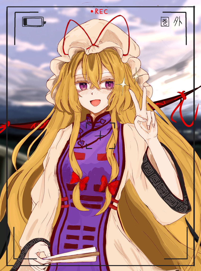 1girl 83mkneinlsqmebq blonde_hair blush dress folded_fan folding_fan gap_(touhou) hair_between_eyes hand_fan hat highres holding holding_fan long_hair long_sleeves looking_at_viewer mob_cap purple_eyes purple_tabard recording smile solo tabard touhou v very_long_hair white_dress yakumo_yukari