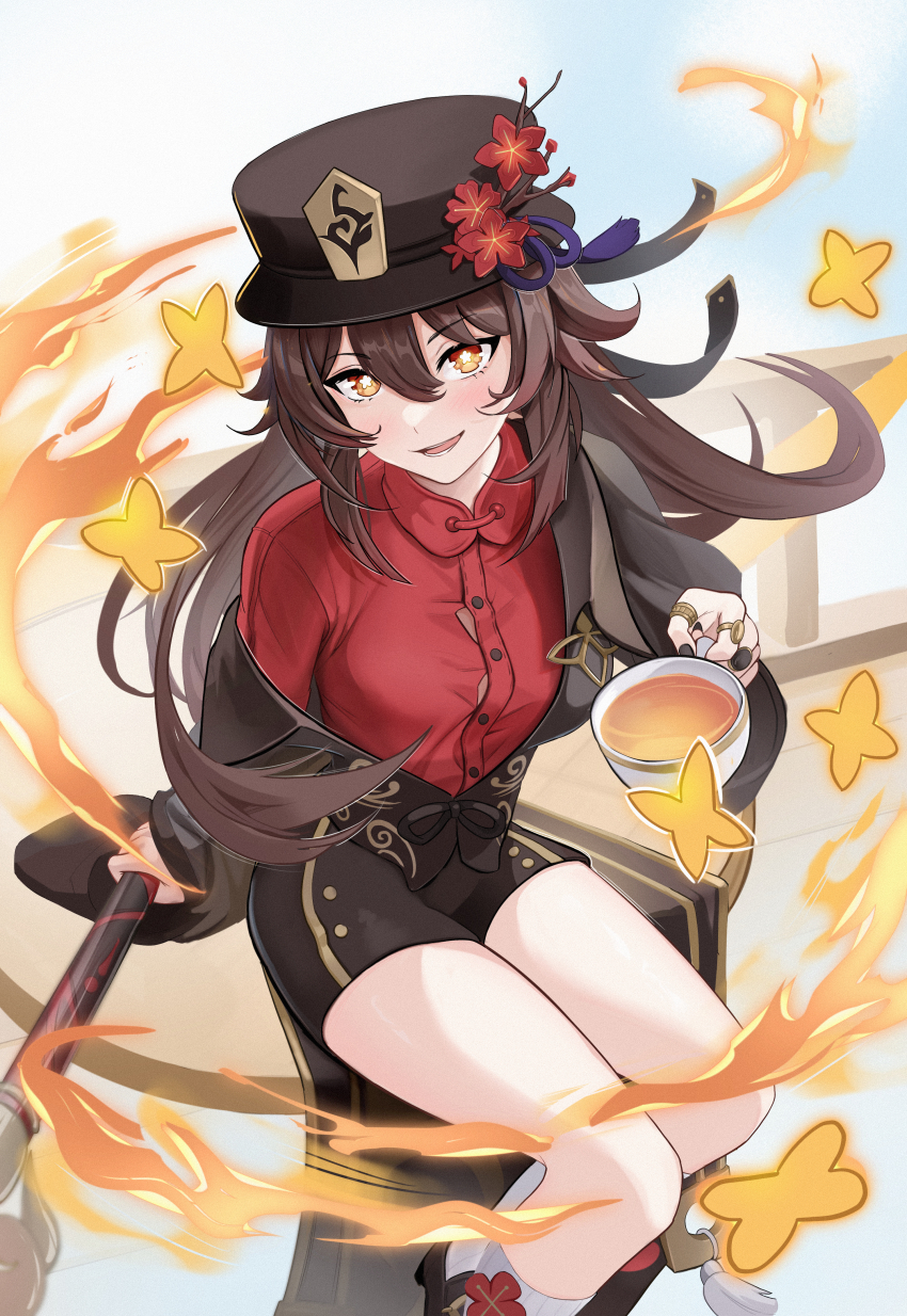 1girl absurdres black_hat black_shorts brown_eyes brown_hair brown_jacket coattails commentary cup fire flower flower-shaped_pupils genshin_impact hair_between_eyes hat hat_flower highres holding holding_cup hu_tao_(genshin_impact) jacket kneehighs long_sleeves mikazeze open_mouth red_shirt shirt short_shorts shorts sitting socks solo symbol-shaped_pupils tea teacup twintails white_socks