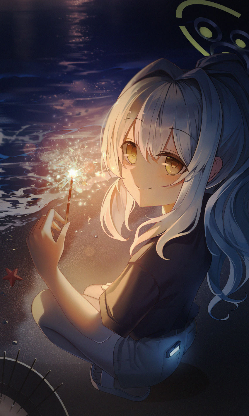 1girl absurdres beach blue_archive closed_mouth fireworks green_halo grey_hair halo hare_(blue_archive) highres holding holding_fireworks leehong_studio light_blush long_hair looking_at_viewer ocean phone_in_pocket ponytail senkou_hanabi shorts sidelocks smile solo sparkler squatting starfish