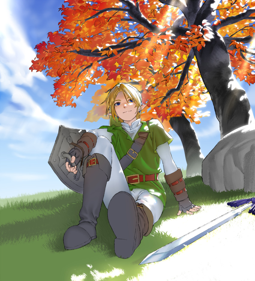 1boy autumn_leaves belt black_boots blonde_hair blue_sky boots brown_gloves closed_mouth cloud commentary_request fingerless_gloves gloves green_tunic highres holding holding_shield leaf link male_focus master_sword mi8pq nintendo on_grass outdoors pants shield sitting sky smile solo sunlight the_legend_of_zelda the_legend_of_zelda:_ocarina_of_time tree tunic white_pants