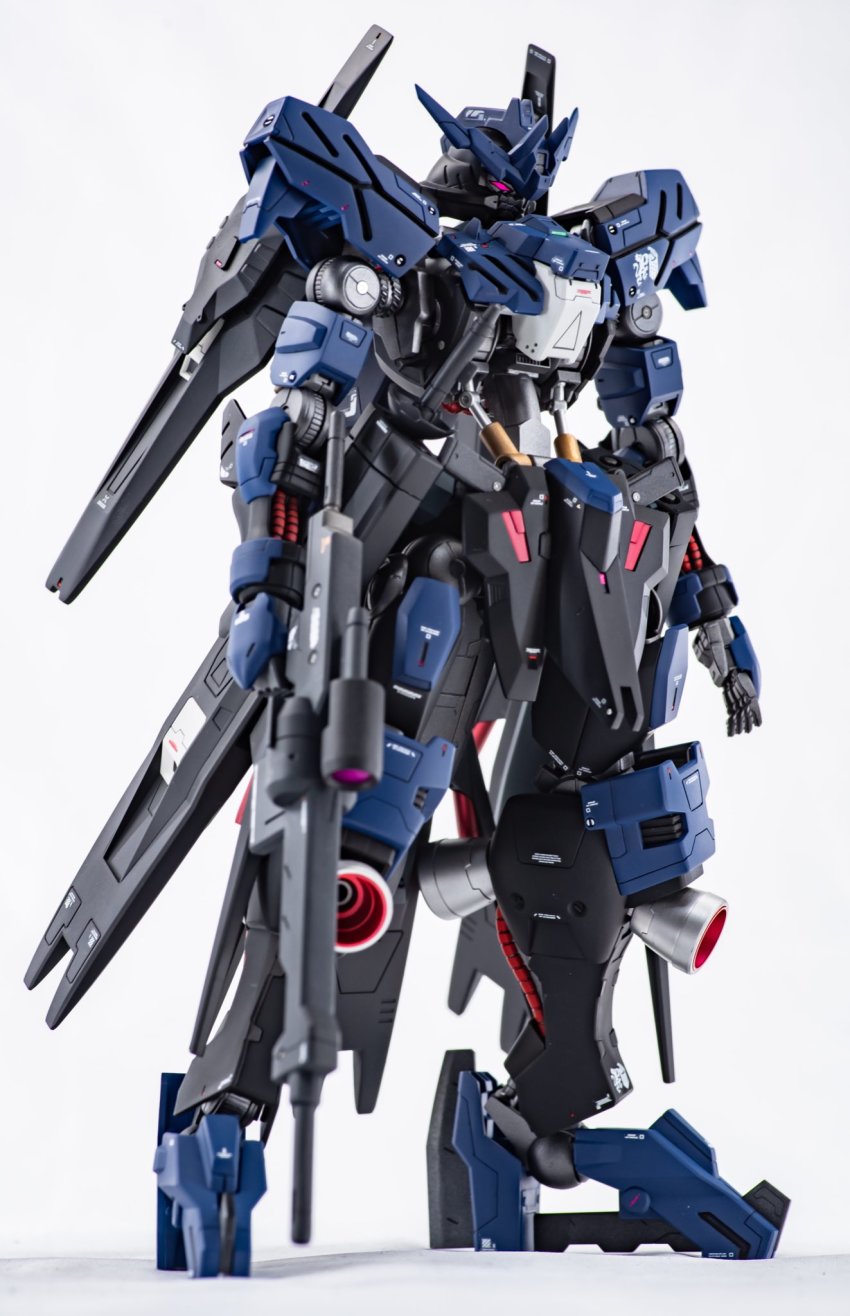 beam_rifle energy_gun gun gundam gundam_tekketsu_no_orphans gundam_vidar gunpla highres holding holding_gun holding_weapon mecha model_kit model_kit_(medium) no_humans photo_(medium) red_eyes robot solo standing takuma-maker:z unconventional_media v-fin weapon