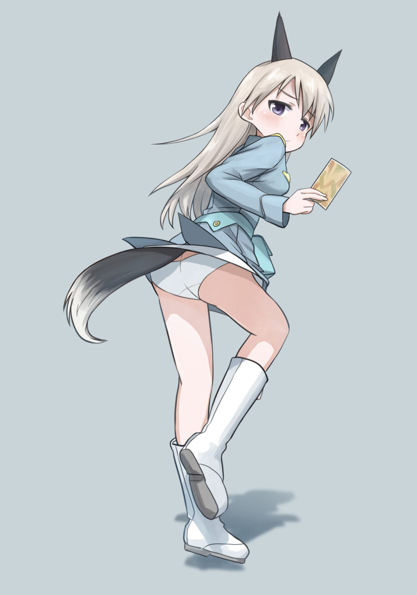1girl animal_ears ass blue_eyes blue_jacket blush boots card closed_mouth commentary crotch_seam dog_ears dog_tail eila_ilmatar_juutilainen from_behind frown full_body grey_background grey_hair highres holding holding_card jacket kk90 leaning_forward long_hair long_sleeves looking_at_viewer looking_back no_legwear no_pants panties shadow simple_background solo standing standing_on_one_leg strike_witches tail underwear white_boots white_panties world_witches_series