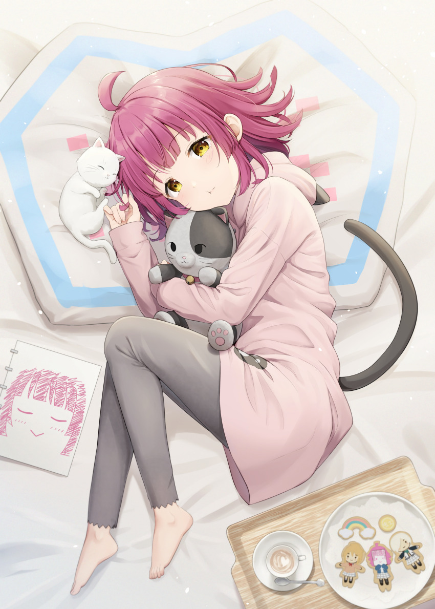 1girl absurdres ahoge animal_hood barefoot black_pants blunt_bangs blunt_ends cat cat_hood cat_tail character_cookie commentary cookie cup dot_nose drawing_(object) fake_tail feet food hanazora_satsuki hanpen_(love_live!) highres holding holding_stuffed_toy hood hoodie latte_art light_blush long_sleeves looking_at_viewer love_live! love_live!_nijigasaki_high_school_idol_club lying medium_hair mia_taylor miyashita_ai on_bed pants pink_hair pink_hoodie puffy_cheeks rina-chan_board saucer sidelocks spoon stuffed_animal stuffed_cat stuffed_toy tail teacup tennoji_rina toenails toes tray white_cat yellow_eyes
