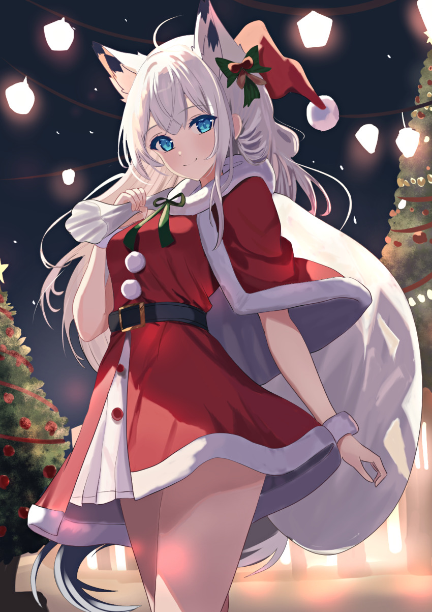 1girl ahoge alternate_costume animal_ear_fluff animal_ears arm_at_side azur_lane bag belt black_belt blue_eyes blush bow capelet christmas christmas_ornaments christmas_tree closed_mouth colored_eyelashes commentary cowboy_shot double-parted_bangs dress fox_ears fox_girl fox_tail fur-trimmed_capelet fur-trimmed_dress fur_trim gift_bag green_bow green_ribbon hair_between_eyes hair_bow hand_up hat highres holding holding_bag kawakaze_(azur_lane) long_hair looking_at_viewer natsuki_(natsu_1936) neck_ribbon night night_sky outdoors pom_pom_(clothes) ribbon santa_capelet santa_costume santa_dress santa_hat sidelighting sky smile solo split_mouth standing tail very_long_hair white_hair white_wrist_cuffs wrist_cuffs