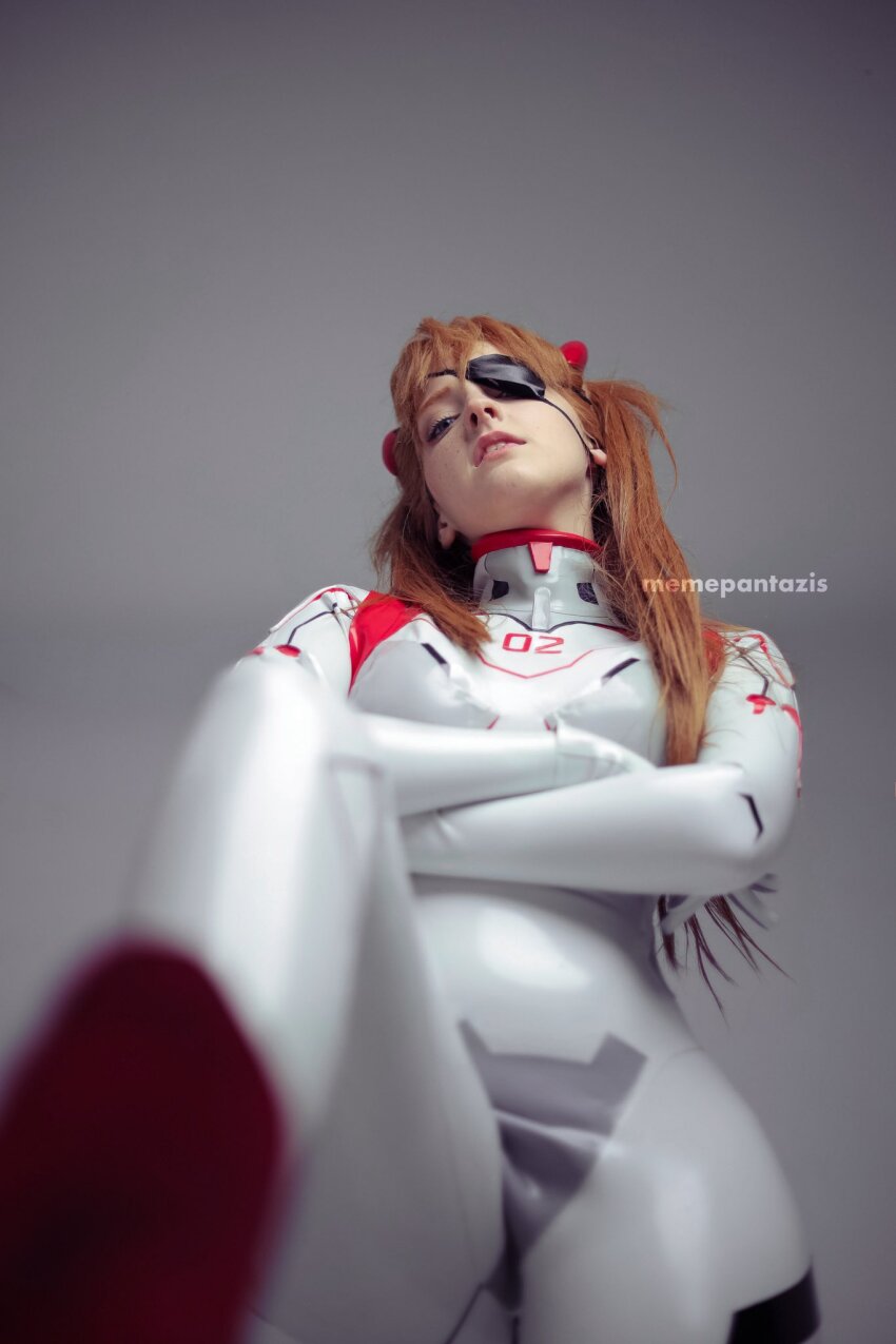 1girl artist_name blue_eyes bodysuit brazilian_(nationality) breasts brown_hair cosplay crossed_arms evangelion:_3.0+1.0_thrice_upon_a_time eyepatch foreshortening freckles highres interface_headset_(evangelion) legs_apart lips looking_at_viewer low_angle mecha_pilot_suit memepantazis neon_genesis_evangelion photo_(medium) plugsuit_(evangelion) rebuild_of_evangelion shiny_clothes simple_background small_breasts solo souryuu_asuka_langley souryuu_asuka_langley_(cosplay) standing tsundere twintails two_side_up white_bodysuit