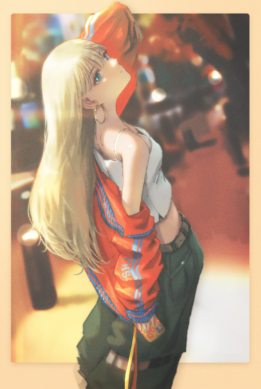 1girl belt black_pants blonde_hair blue_eyes blurry blurry_background border camisole cellphone closed_mouth commentary crop_top depth_of_field earrings expressionless feet_out_of_frame film_grain highres holding holding_phone hoop_earrings jacket jewelry long_hair looking_at_viewer original outside_border pants phone red_jacket shann_pierre single_off_shoulder smartphone solo spaghetti_strap standing white_camisole yellow_border