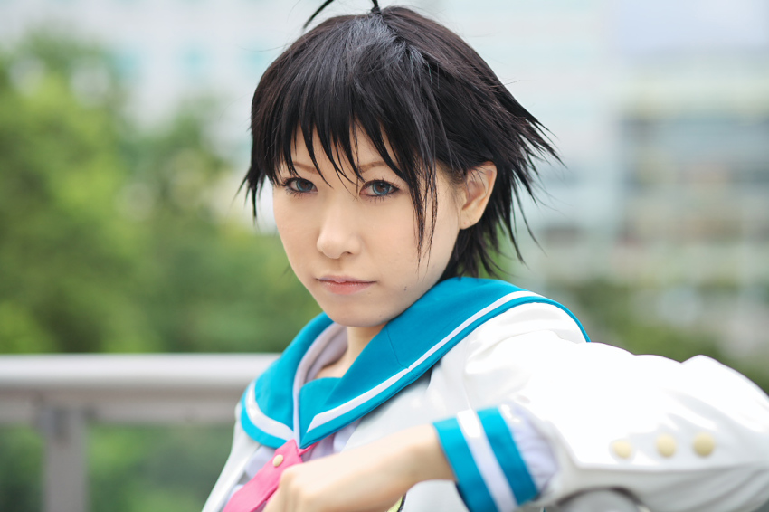 1girl ahoge asian black_hair blue_eyes chippi color_contacts cosplay female_focus idolmaster idolmaster_xenoglossia kikuchi_makoto kikuchi_makoto_(cosplay) looking_at_viewer outdoors photo_(medium) school_uniform serafuku short_hair solo