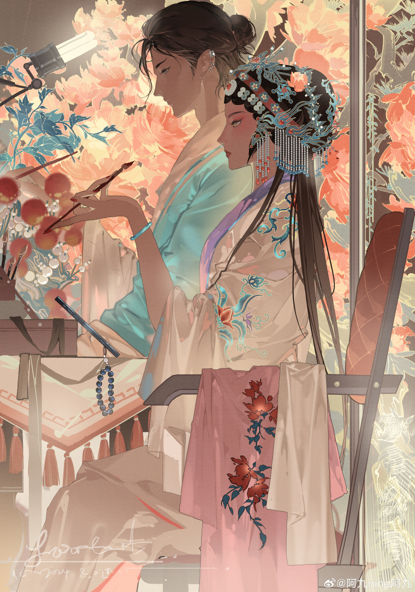 1boy 1girl absurdres ajiu_nine_ajiu applying_makeup aqua_hanfu bangle beads black_hair bracelet cellphone_charm chair charm_(object) chinese_clothes chinese_commentary floral_print hair_bun hanfu headdress highres jewelry lamp makeup original paintbrush peking_opera sitting tassel
