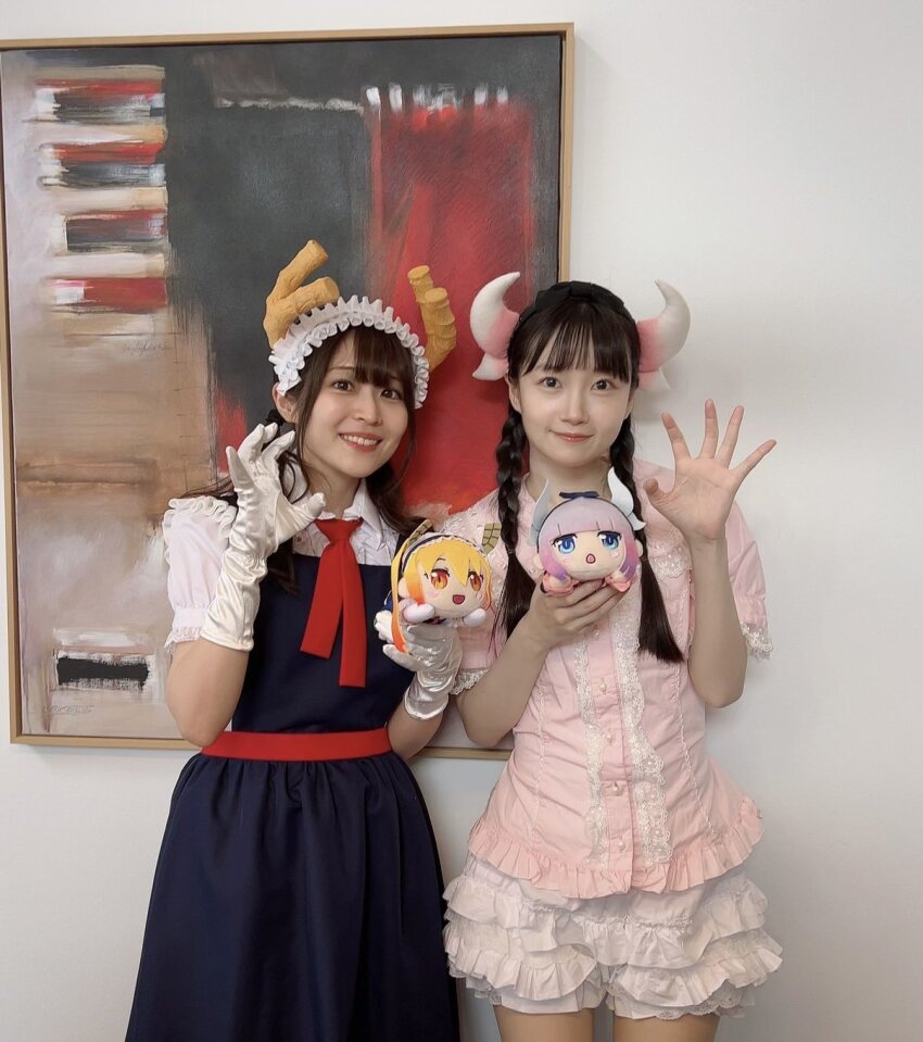 2girls fake_horns highres horns ilulu_(maidragon) kobayashi-san_chi_no_maidragon kuwahara_yuuki multiple_girls naganawa_maria photo_(medium) stuffed_toy tohru_(maidragon)
