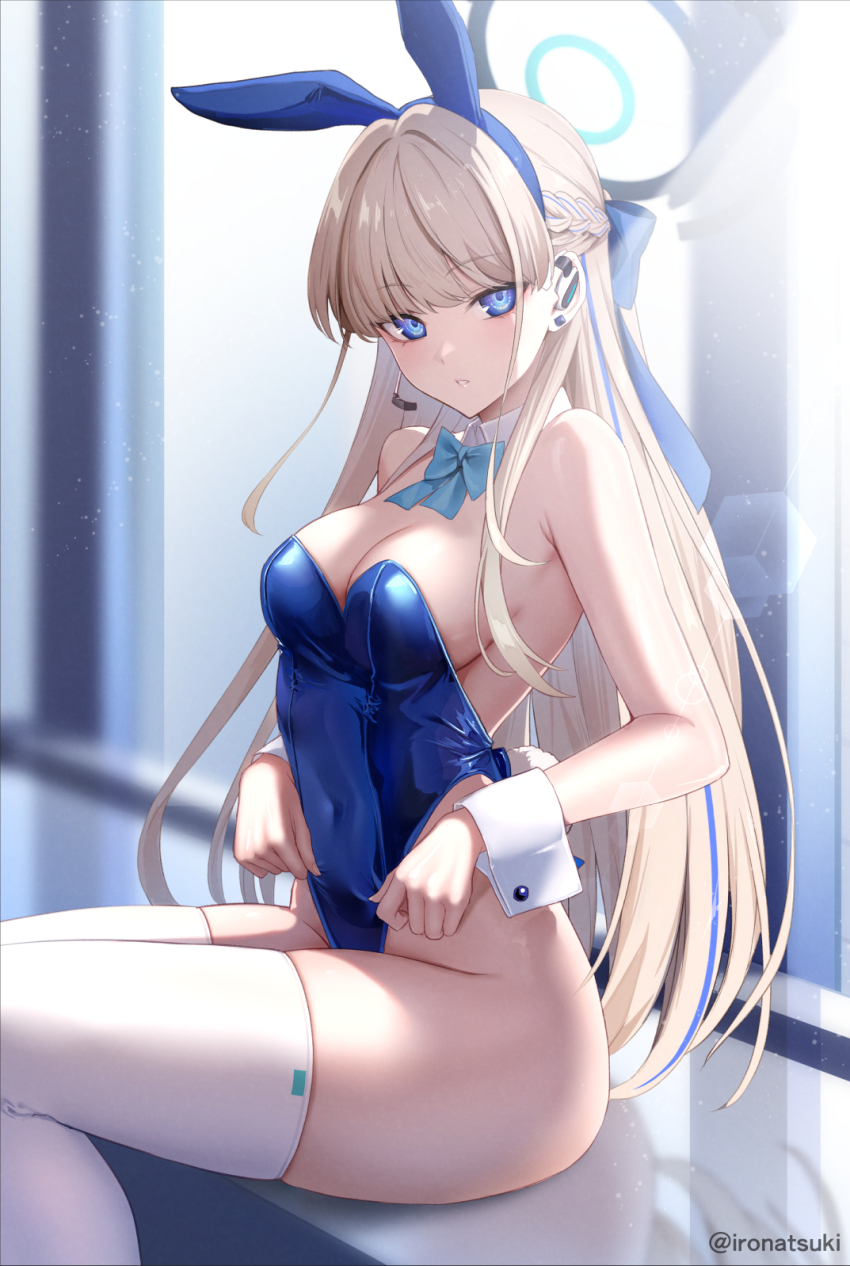 1girl animal_ears armpit_crease bare_arms bare_shoulders blonde_hair blue_archive blue_eyes blue_hairband blue_leotard blurry bow bowtie braid breasts cleavage covered_navel depth_of_field detached_collar earpiece fake_animal_ears hair_bow hairband halo highleg highleg_leotard highres ironatsuki leotard long_hair looking_at_viewer medium_breasts multicolored_hair official_alternate_costume parted_lips playboy_bunny rabbit_ears sitting strapless strapless_leotard streaked_hair thighhighs thighs toki_(blue_archive) toki_(bunny)_(blue_archive) very_long_hair white_thighhighs wrist_cuffs