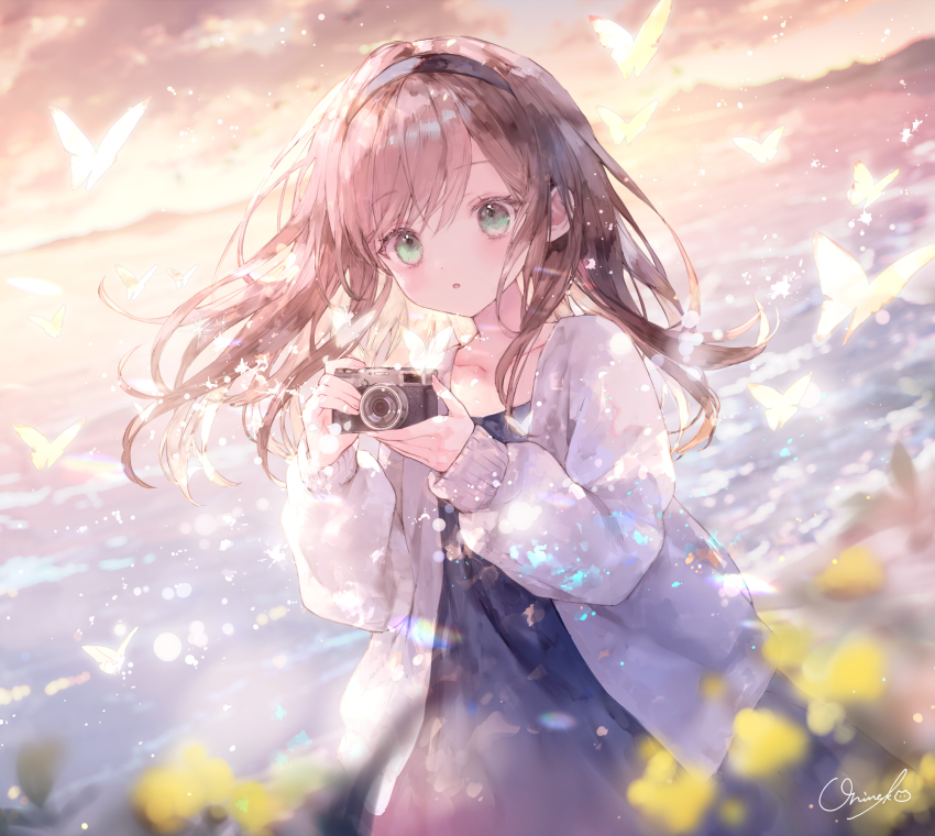 :o animal blue_dress blurry blurry_background blurry_foreground brown_hair bug butterfly camera cloud collarbone commentary depth_of_field dress flower green_eyes hair_between_eyes highres holding holding_camera insect jacket long_hair long_sleeves onineko open_clothes open_jacket original outdoors parted_lips puffy_long_sleeves puffy_sleeves signature sky sleeves_past_wrists sunset symbol-only_commentary water white_jacket yellow_flower