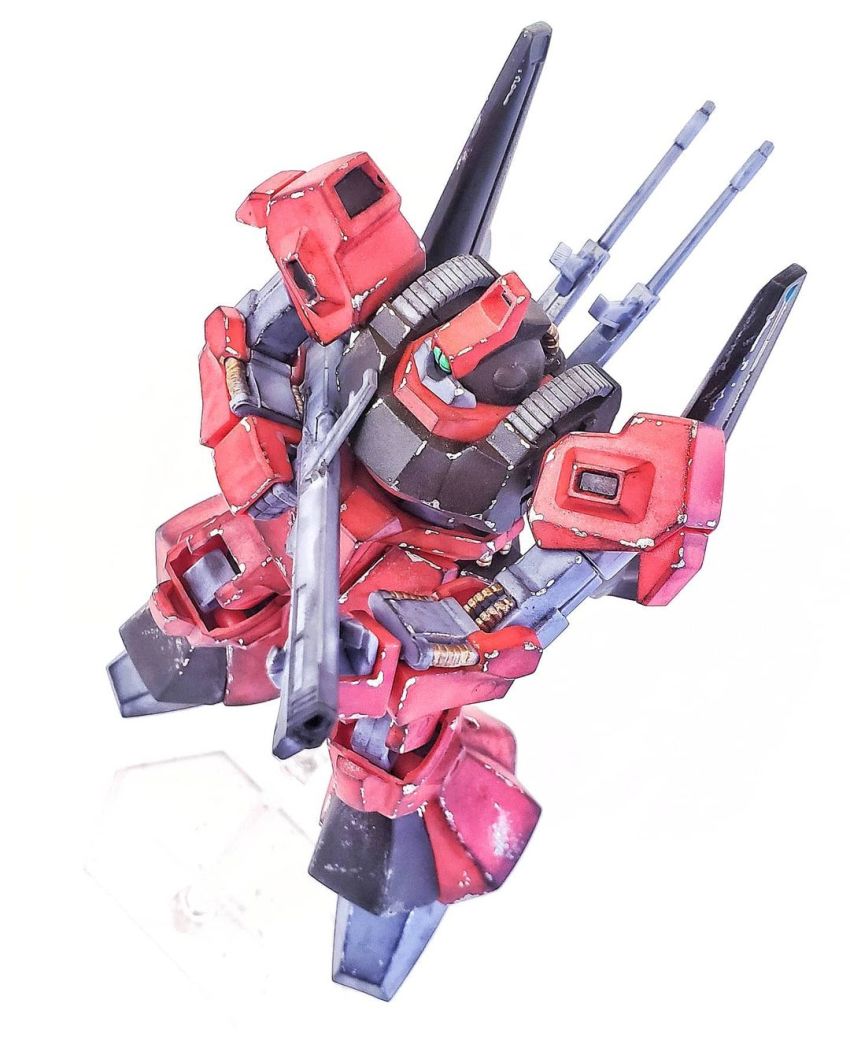 cobra_plamonder green_eyes gun gundam gunpla highres holding holding_gun holding_weapon looking_to_the_side mecha model_kit model_kit_(medium) no_humans one-eyed photo_(medium) rick_dias robot unconventional_media weapon zeta_gundam