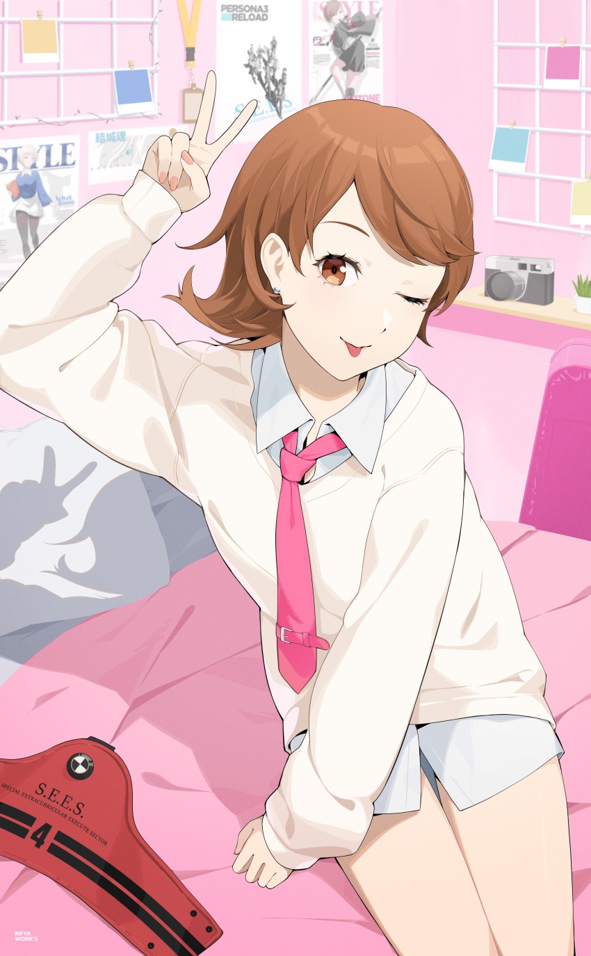1girl absurdres alternate_costume arm_up armband artist_name bare_legs bedroom brown_eyes brown_hair camera collared_shirt commentary earrings english_commentary feet_out_of_frame flipped_hair hand_up highres indoors jewelry long_sleeves looking_at_viewer nail_polish necktie no_pants on_bed one_eye_closed persona persona_3 persona_3_reload pillow pink_lips pink_nails pink_necktie poster_(object) red_armband rifyaa s.e.e.s shirt short_hair sitting sleeves_past_wrists smile solo stud_earrings sweater swept_bangs takeba_yukari thighs tongue tongue_out unworn_armband v white_shirt white_sweater