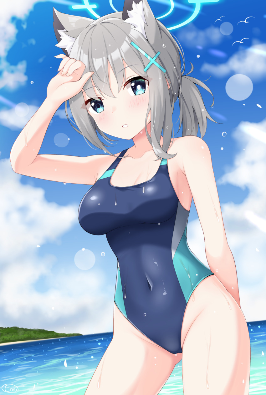 1girl animal_ear_fluff animal_ears beach blue_archive blue_eyes blue_one-piece_swimsuit breasts competition_swimsuit cowboy_shot cross_hair_ornament enru grey_hair hair_ornament halo highres horizon leaning_forward low_ponytail medium_breasts medium_hair mismatched_pupils ocean one-piece_swimsuit outdoors ponytail shiroko_(blue_archive) shiroko_(swimsuit)_(blue_archive) solo swimsuit wet