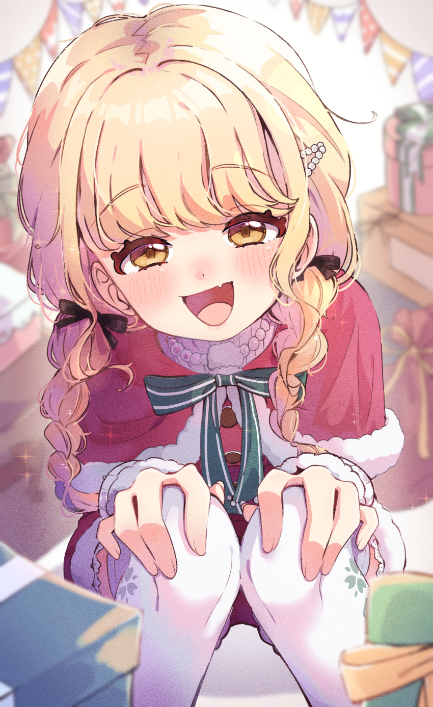 absurdres black_ribbon blonde_hair blush box braid capelet christmas commentary_request fang fujita_kotone fur-trimmed_capelet fur_trim gakuen_idolmaster gift gift_box hair_ribbon hands_on_own_knees highres idolmaster long_hair looking_at_viewer official_alternate_costume puyori_lia red_capelet ribbon skin_fang smile squatting string_of_flags twin_braids yellow_eyes