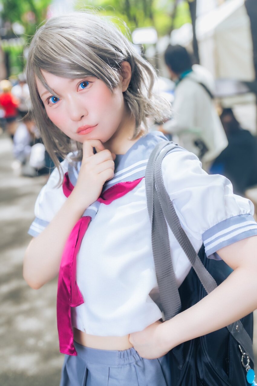 1girl bag blue_eyes breasts brown_hair cosplay cosplay_photo grey_hair highres love_live! love_live!_sunshine!! midriff photo_(medium) real_life school_bag school_uniform serafuku short_hair skirt solo stomach uranohoshi_school_uniform watanabe_you