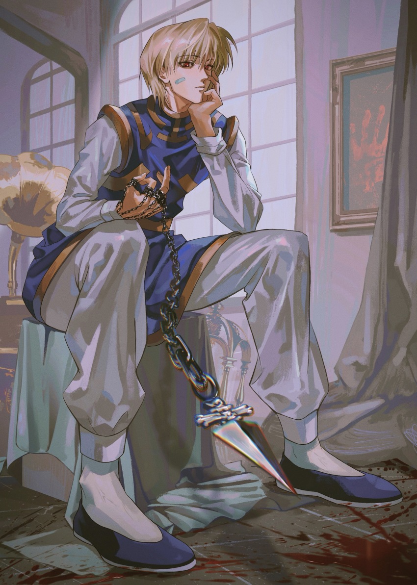 1boy absurdres bandaid bandaid_on_face blonde_hair blood blood_on_ground blue_slippers blue_tabard chinese_commentary closed_mouth commentary_request elbow_on_leg gold_trim hair_behind_ear hand_chains hand_on_own_face head_rest highres holding holding_weapon hunter_x_hunter indoors kurapika long_sleeves looking_down male_focus middle_finger painting_(object) pants phonograph ppttppff red_eyes short_hair sitting sleeve_cuffs slippers solo tabard weapon white_pants window