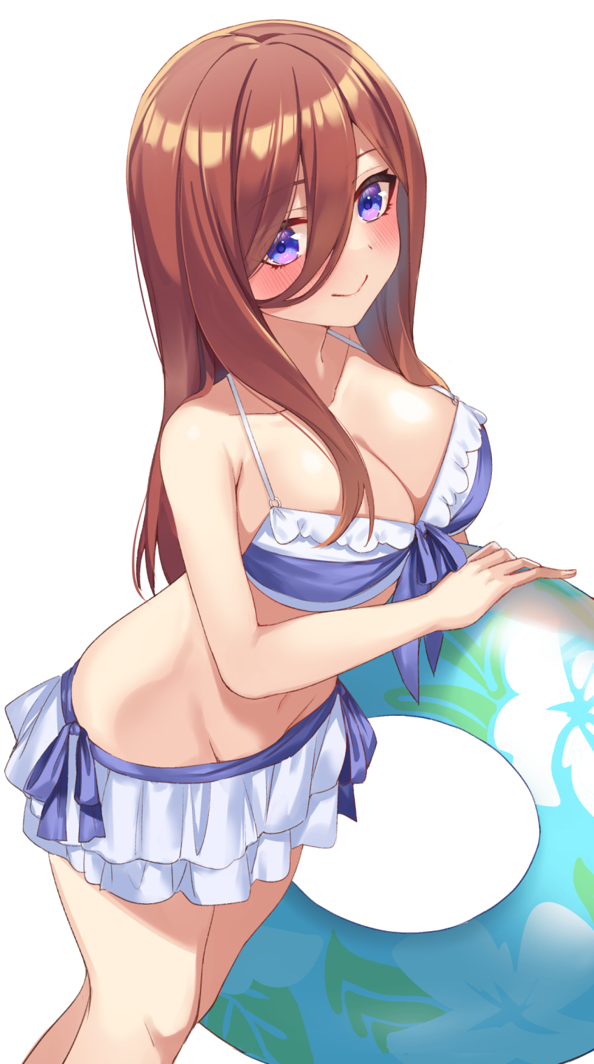 1girl bikini bikini_skirt blue_bikini blue_innertube blush breasts brown_hair cleavage closed_mouth commentary_request feet_out_of_frame go-toubun_no_hanayome hachiroku_(hatirokusann86) hair_ornament highres large_breasts leaning_forward long_hair looking_at_viewer nakano_miku purple_eyes simple_background smile solo standing swimsuit white_background