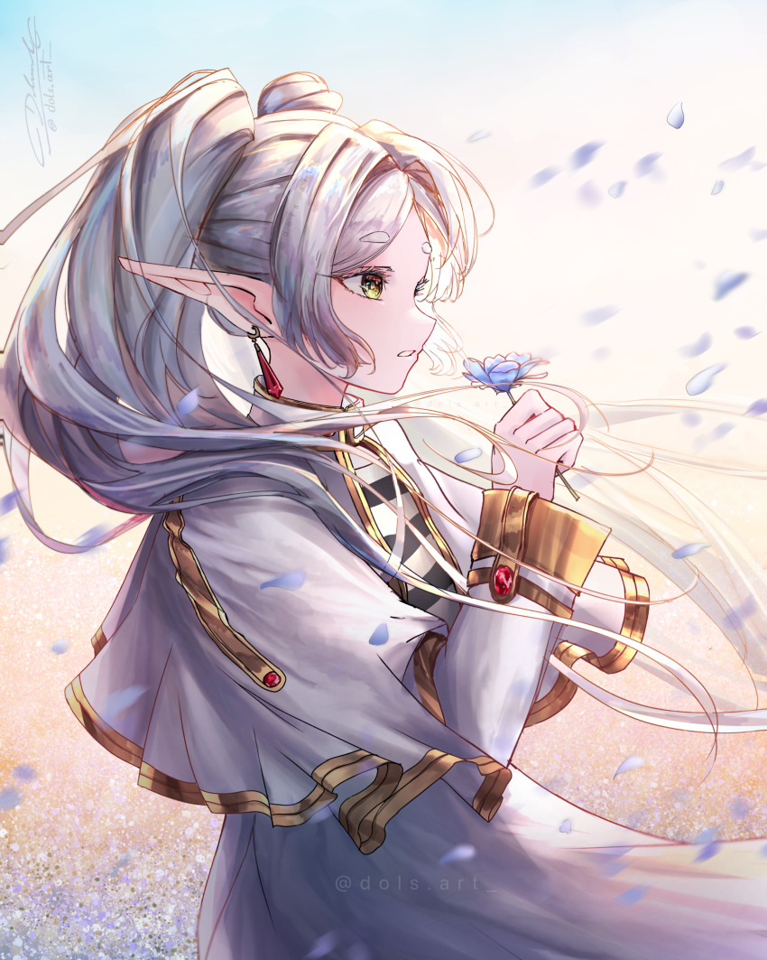 1girl absurdres blue_flower capelet commentary cowboy_shot dols_art earrings elf english_commentary falling_petals floating_hair flower frieren from_side green_eyes hand_up highres holding holding_flower jewelry long_hair outdoors parted_lips petals pointy_ears shirt signature skirt solo sousou_no_frieren striped_clothes striped_shirt twintails very_long_hair white_capelet white_hair white_skirt wind