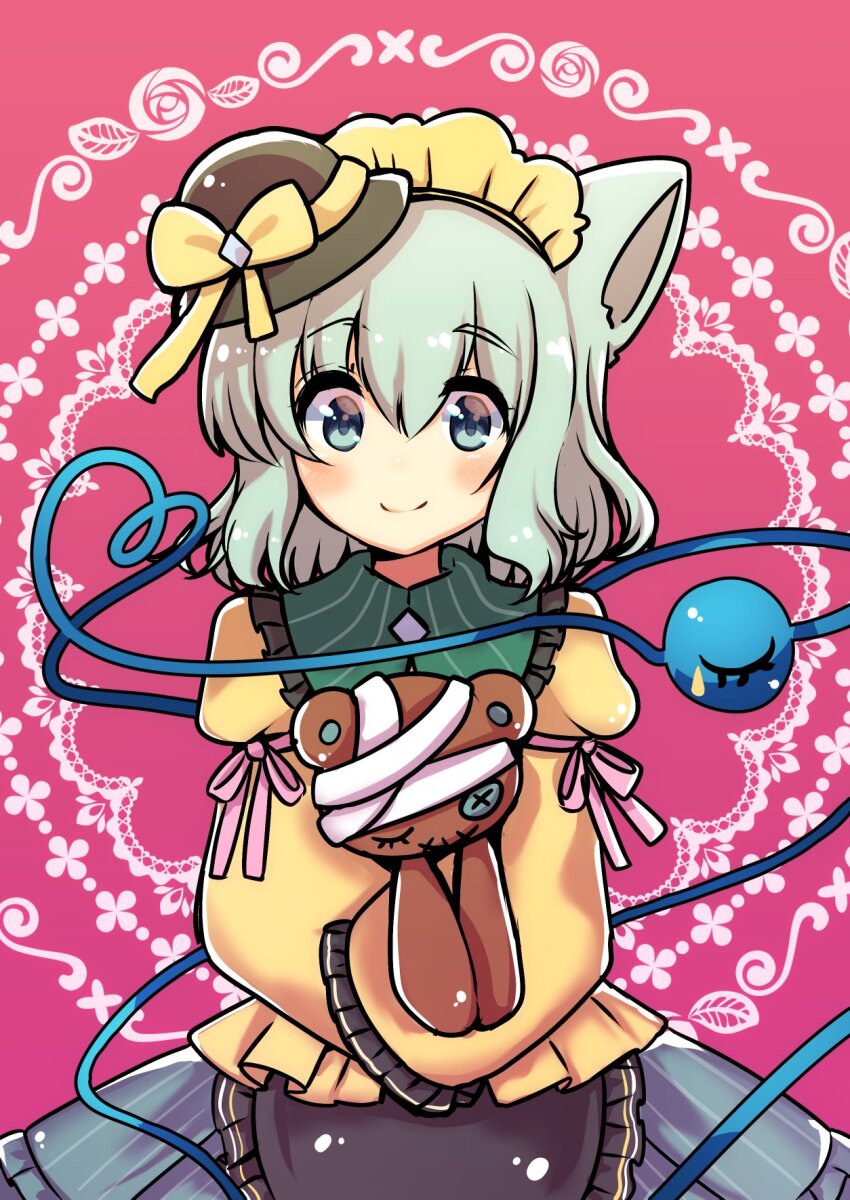 1girl animal_ears apron bandages black_apron black_hat blouse blush bow closed_mouth commentary_request cowboy_shot eyes_visible_through_hair frilled_apron frilled_shirt_collar frilled_sleeves frills green_eyes green_hair grey_skirt hair_between_eyes halloween hat hat_bow hat_ribbon heart heart_of_string highres holding holding_stuffed_toy kemonomimi_mode komeiji_koishi long_sleeves maid_headdress medium_hair mini_hat no_nose partial_commentary pink_background pink_ribbon rapameri ribbon shirt skirt sleeve_garter sleeves_past_fingers sleeves_past_wrists smile solo split_mouth stuffed_animal stuffed_toy teddy_bear third_eye touhou waist_apron white_background yellow_bow yellow_ribbon yellow_shirt