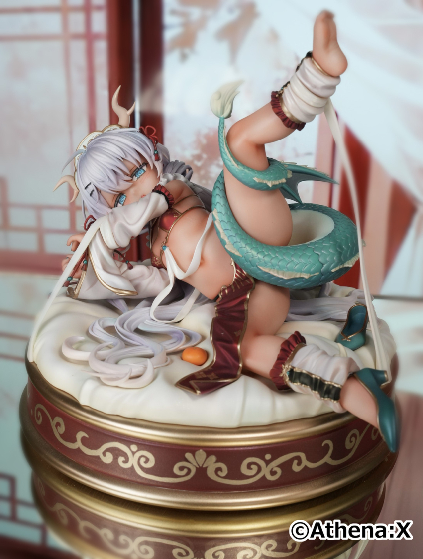 1girl aqua_shoes bikini bikini_top_only black_nails blue_eyes blush breasts dark-skinned_female dark_skin detached_sleeves dragon_girl dragon_horns dragon_tail dragon_wings feet figure_(medium) food fruit half-closed_eyes highres horns kneepits leg_up loli long_hair looking_at_viewer lying mandarin_orange micro_bikini mini_wings nail_polish navel on_side original photo_(medium) red_bikini revealing_clothes shoes single_shoe small_breasts soles solo spread_legs sweatdrop swimsuit tail tail_censor toenail_polish toenails toes trente unworn_shoes white_hair wings