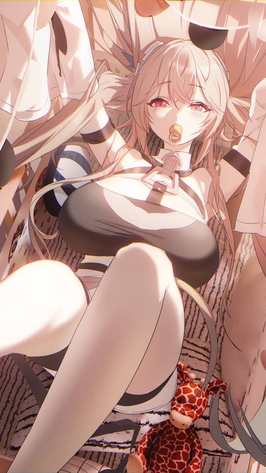 1girl absurdres anchorage_(azur_lane) azur_lane black_shorts black_tube_top breasts brown_hair chinese_commentary cradle detached_sleeves hair_spread_out highres huge_breasts long_hair long_sleeves lying on_back pacifier pink_eyes shorts sleeves_past_fingers sleeves_past_wrists solo strapless stuffed_animal stuffed_giraffe stuffed_toy thighs tube_top very_long_sleeves yuyiosang