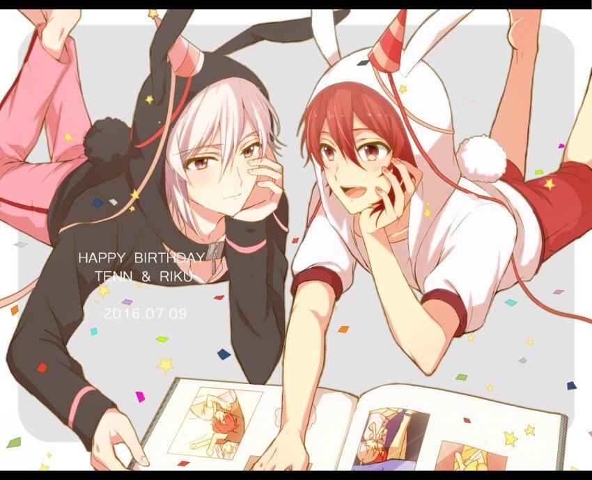 2boys animal_ear_hood animal_ears asymmetrical_hair barefoot black_border book border brown_eyes closed_mouth confetti english_text fake_animal_ears fake_tail feet_out_of_frame grey_background hand_on_own_cheek hand_on_own_face happy happy_birthday hat hat_ornament hood hood_up hooded_jacket idolish7 jacket kujou_tenn legs_up letterboxed long_sleeves looking_at_object lying male_focus mini_party_hat multiple_boys nanase_riku nau_(rg_sn79) on_stomach open_book open_mouth outside_border pants photo_album pink_hat pink_pants puffy_short_sleeves puffy_sleeves rabbit_ears rabbit_tail red_eyes red_hair red_hat red_shorts short_hair short_sleeves shorts smile star_(symbol) star_hat_ornament streamers striped_hat sweatpants tail teeth upper_teeth_only white_border white_hair white_jacket