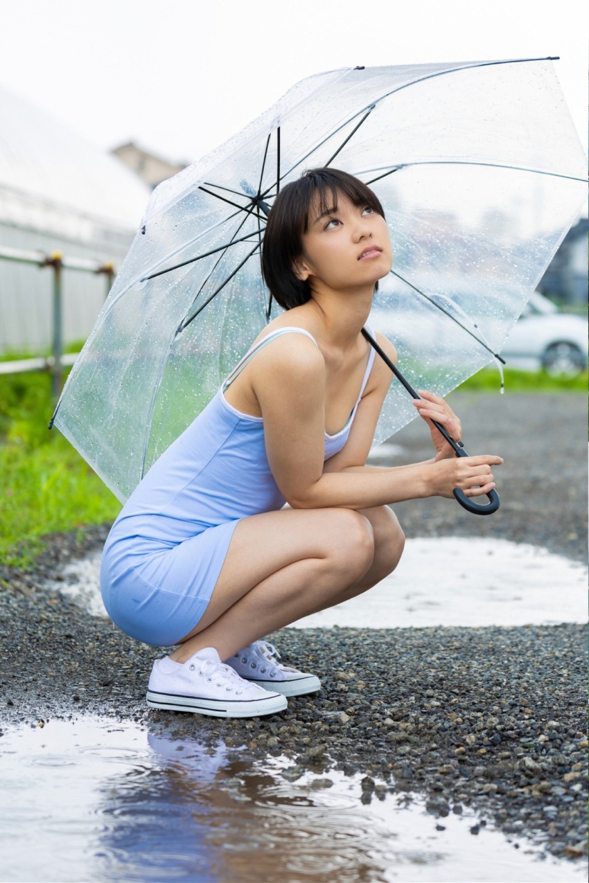 1girl black_hair blue_dress blurry blurry_background collarbone dress flat_chest japanese_(nationality) looking_up monami_suzu outdoors photo_(medium) shoes short_hair sneakers umbrella water
