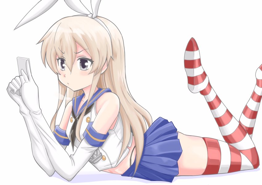 1girl anchor_hair_ornament cellphone commentary_request elbow_gloves feet_up female_focus gloves green_eyes hair_between_eyes hair_ornament highres inoue_kousei kantai_collection long_hair lying midriff on_stomach phone pleated_skirt school_uniform serafuku shimakaze_(kancolle) shirt sidelocks skirt sleeveless sleeveless_shirt smartphone solo striped_clothes striped_thighhighs thighhighs white_background