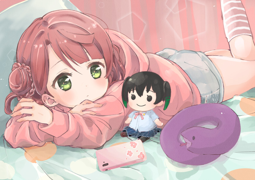 1girl absurdres blunt_bangs braid braided_bun cellphone character_doll commentary crossed_arms doll eyebrows_hidden_by_hair green_eyes grey_shorts hacosumi hair_bun head_rest highres hood hoodie kneehighs leg_up light_blush light_frown looking_to_the_side love_live! love_live!_nijigasaki_high_school_idol_club lying on_stomach phone pink_hair pink_hoodie pink_socks sasuke_(love_live!) shorts single_side_bun smartphone snake socks solo striped_clothes striped_socks takasaki_yu uehara_ayumu
