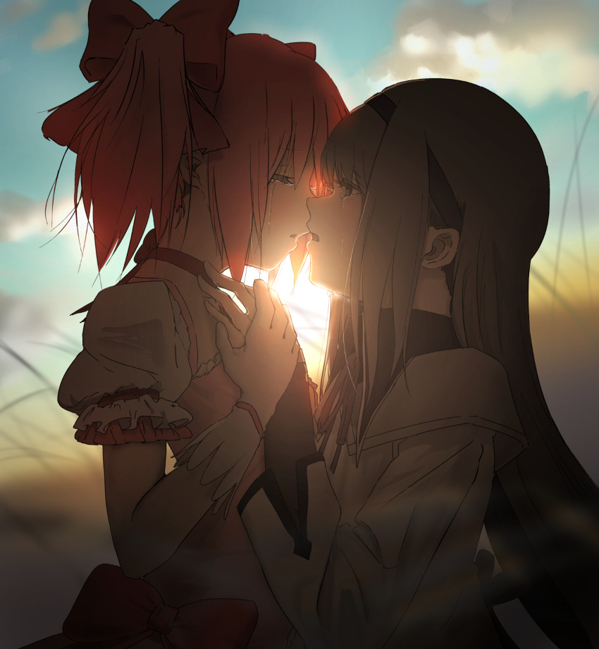 2girls akemi_homura black_hair bow closed_eyes commentary crying evening hair_bow hairband highres imminent_kiss kaname_madoka long_hair magical_girl mahou_shoujo_madoka_magica multiple_girls orange_sky outdoors parted_lips pink_hair purple_eyes ribbon short_hair short_twintails sky streaming_tears sunset takeraka tears twintails yuri