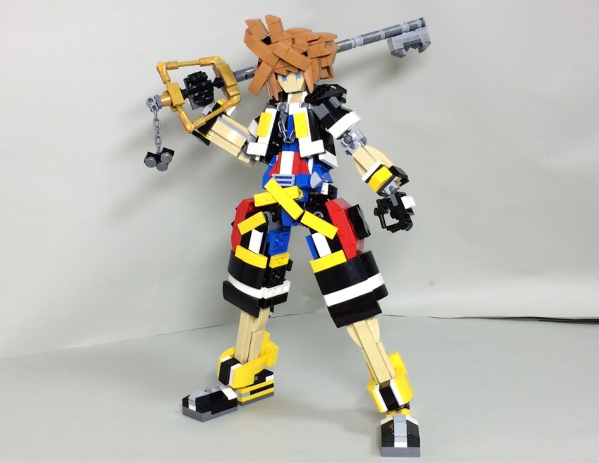 1boy black_hoodie black_shoes black_shorts blue_eyes blue_shirt brown_hair full_body holding holding_weapon hood hood_down hoodie keyblade kingdom_hearts kingdom_hearts_ii lego_(medium) nanoka_boozu over_shoulder shirt shoes short_hair shorts sneakers solo sora_(kingdom_hearts) unconventional_media weapon weapon_over_shoulder