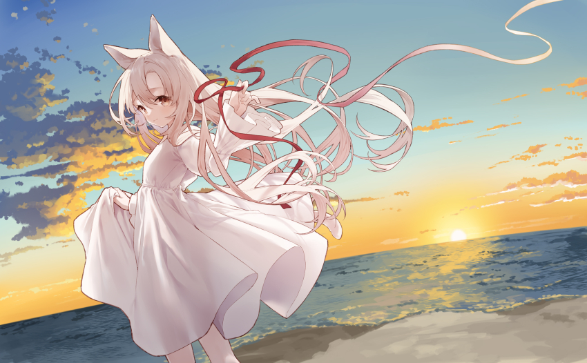 1girl animal_ears beach bell blue_sky brown_eyes brown_hair closed_mouth cloud commentary_request dress floating_hair hair_between_eyes highres holding holding_ribbon horizon jingle_bell long_hair ocean original outdoors red_ribbon ribbon sand skirt_hold sky smile solo standing sunset tokuno_yuika very_long_hair water white_dress wide_sleeves