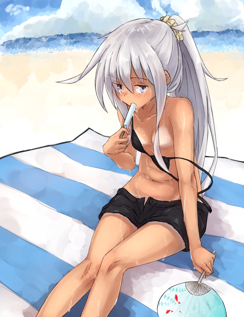 1girl alternate_hairstyle beach bikini bikini_top_only black_bikini black_shorts blue_eyes blue_sky cloudy day food hair_between_eyes hair_over_breasts hair_over_one_breast hand_fan hibiki_(kancolle) highres ice kantai_collection kuuru_(kuuru-n) long_hair looking_at_viewer ocean paper_fan ponytail popsicle short_shorts shorts silver_hair sitting sky swimsuit tan tanline uchiwa verniy_(kancolle)