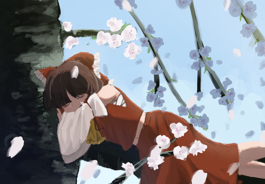 1girl ascot bow brown_hair chest_sarashi closed_eyes commentary detached_sleeves falling_petals flower hair_bow hair_tubes hakurei_reimu highres long_hair lying_on_branch marisuku navel petals red_bow red_skirt ribbon-trimmed_sleeves ribbon_trim sarashi skirt skirt_set solo touhou yellow_ascot