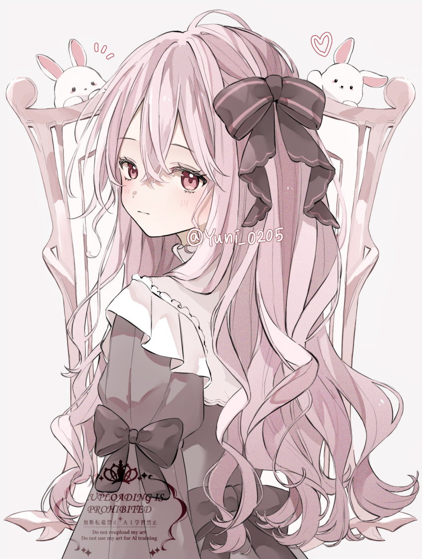 1girl black_bow black_dress blush bow closed_mouth commentary_request dress hair_between_eyes hair_bow heart highres long_hair looking_at_viewer looking_back notice_lines original pink_eyes pink_hair rabbit solo upper_body watermark wavy_hair white_rabbit_(animal) yuni_0205