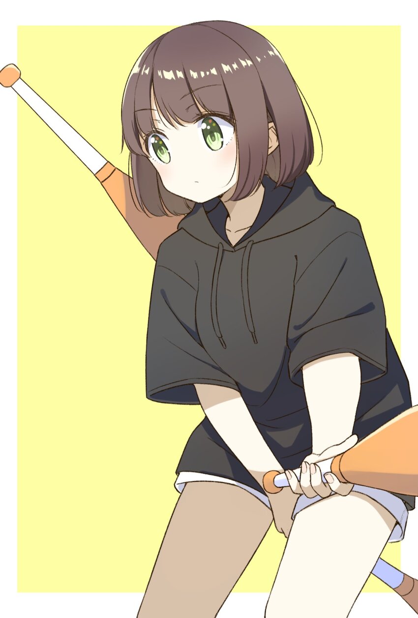 1girl black_hoodie brown_hair chintara10 closed_mouth cowboy_shot green_eyes highres holding_juggling_club hood hoodie juggling_club medium_hair original shorts solo white_shorts yellow_background