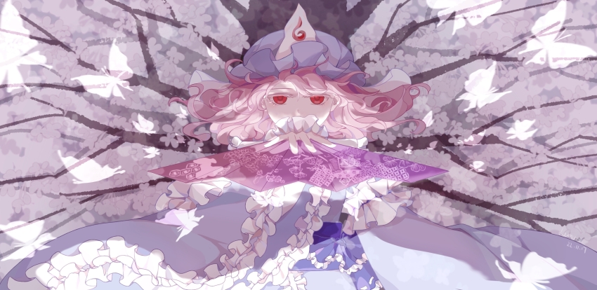 1girl alternate_eye_color arm_at_side blue_hat blue_kimono cherry_blossoms chinese_commentary commentary_request covered_mouth floating_hair frilled_kimono frilled_sleeves frills hand_fan hand_up hat highres holding holding_fan japanese_clothes kimono lemurea long_sleeves looking_at_viewer medium_hair mob_cap obi pink_hair red_eyes saigyou_ayakashi saigyouji_yuyuko saigyouji_yuyuko&#039;s_fan_design sash sleeve_garter solo touhou tree triangular_headpiece upper_body wide_sleeves