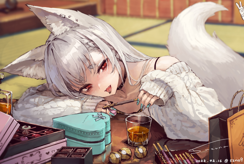 1girl albino animal_ear_fluff animal_ears aqua_nails arm_rest artist_name bag bare_shoulders black_choker blurry box box_of_chocolates chocolate choker commentary cup dated depth_of_field drink fox_ears fox_tail head_rest head_tilt heart-shaped_box highres indoors kotatsu long_sleeves looking_at_viewer nail_polish off-shoulder_sweater off_shoulder original piercing red_eyes shopping_bag signature sleeves_past_wrists solo suzuno_(bookshelf) sweater symbol-only_commentary table tail tatami thick_eyebrows tongue tongue_out tongue_piercing white_hair