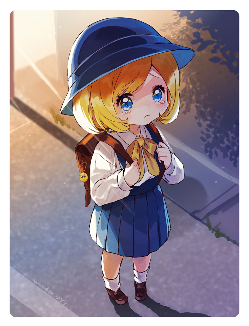 1girl bag blonde_hair blue_eyes blue_hat blue_skirt border bow bowtie brown_bag brown_shoes charm_(object) child cloche_hat closed_mouth commentary emoji hat highres kuroda_(kuro_yyy) loafers long_sleeves looking_at_viewer lost_child medium_hair original pleading_face_emoji pleated_skirt road school_bag shadow shirt shoes skirt sleeves_past_wrists socks solo tearing_up tears white_border white_shirt white_socks yellow_bow