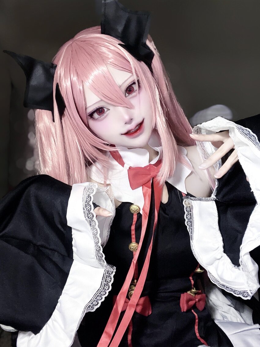 1girl absurdres aegyo_sal black_bow black_dress bow cosplay_photo double-parted_bangs dress eyelashes grin hair_between_eyes hair_bow hands_up head_tilt highres krul_tepes lace-trimmed_sleeves lace_trim long_hair long_sleeves looking_at_viewer neck_ribbon owari_no_seraph photo_(medium) pink_hair red_eyes red_lips red_ribbon ribbon sleeves_past_wrists smile solo two_side_up upper_body vv_yxx wide_sleeves