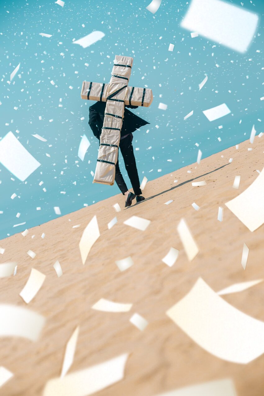 1boy black_straps blue_sky cross_punisher formal_clothes highres large_cross male_focus nicholas_d._wolfwood outdoors paper punisher_(trigun) sky suit trigun weiwei_cos