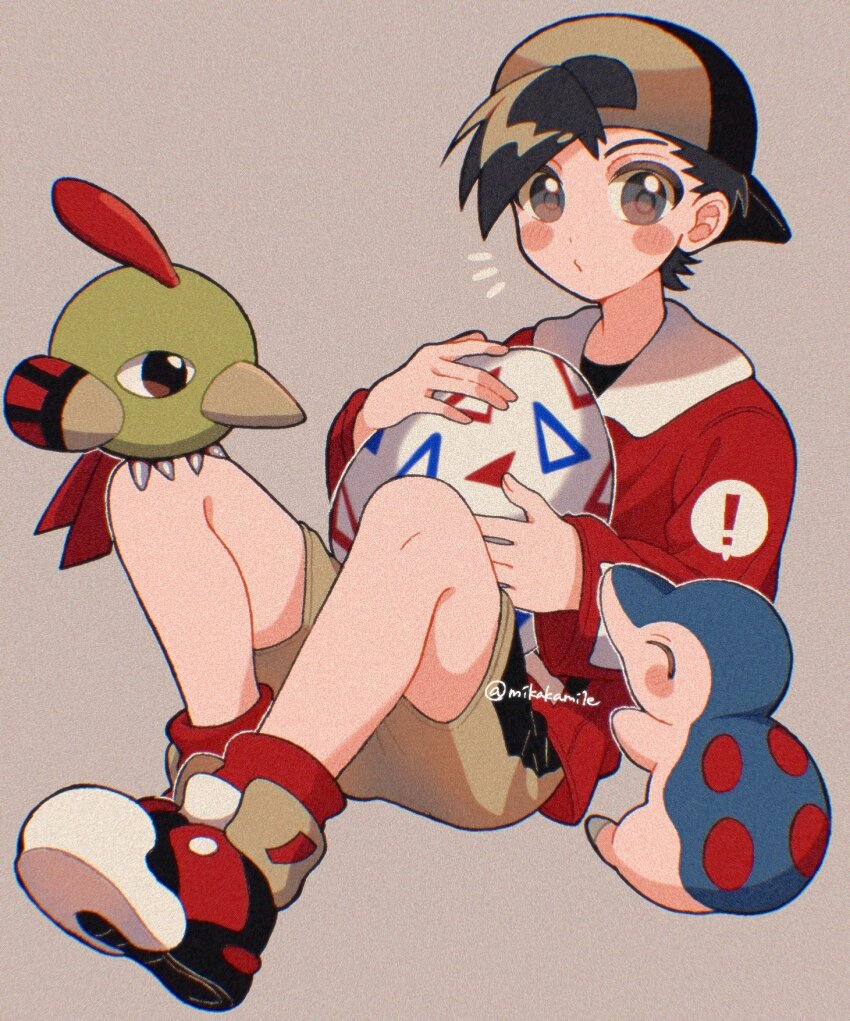 ! 1boy backwards_hat baseball_cap bird black_hair blush blush_stickers closed_mouth creatures_(company) cyndaquil egg ethan_(pokemon) film_grain game_freak gen_2_pokemon grey_background grey_eyes hat highres holding holding_egg jacket knees_up long_sleeves looking_at_viewer male_focus mikakami1e natu nintendo notice_lines pokemon pokemon_(creature) pokemon_gsc red_jacket shoes short_hair shorts sitting togepi_egg twitter_username yellow_shorts